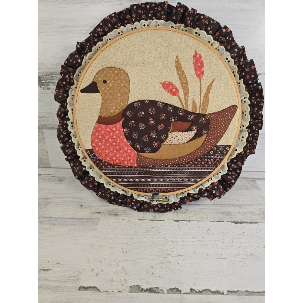vintage 1970s quilted patchwork duck wall art piece set within a wooden embroide